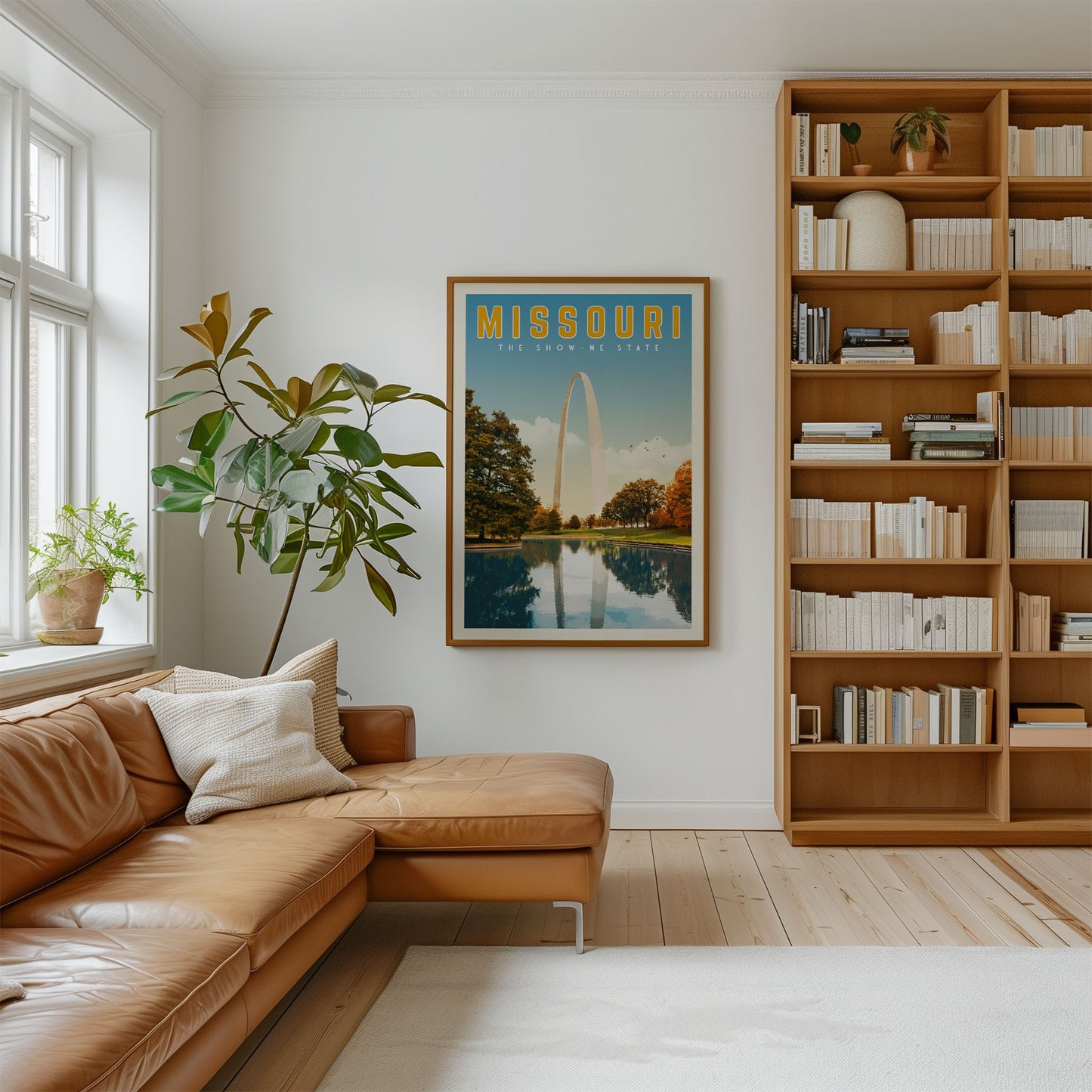 a cozy living room with a large bookshelf filled with books, a comfortable leather couch, and a framed poster of the Missouri state.