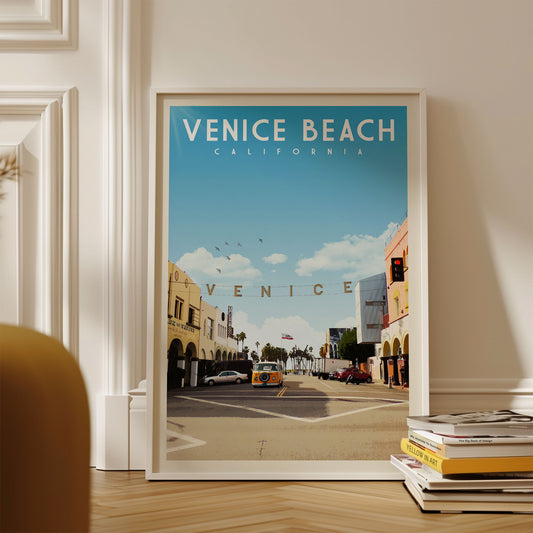 The image is a framed poster of Venice Beach, California, featuring a street scene with cars and buildings.