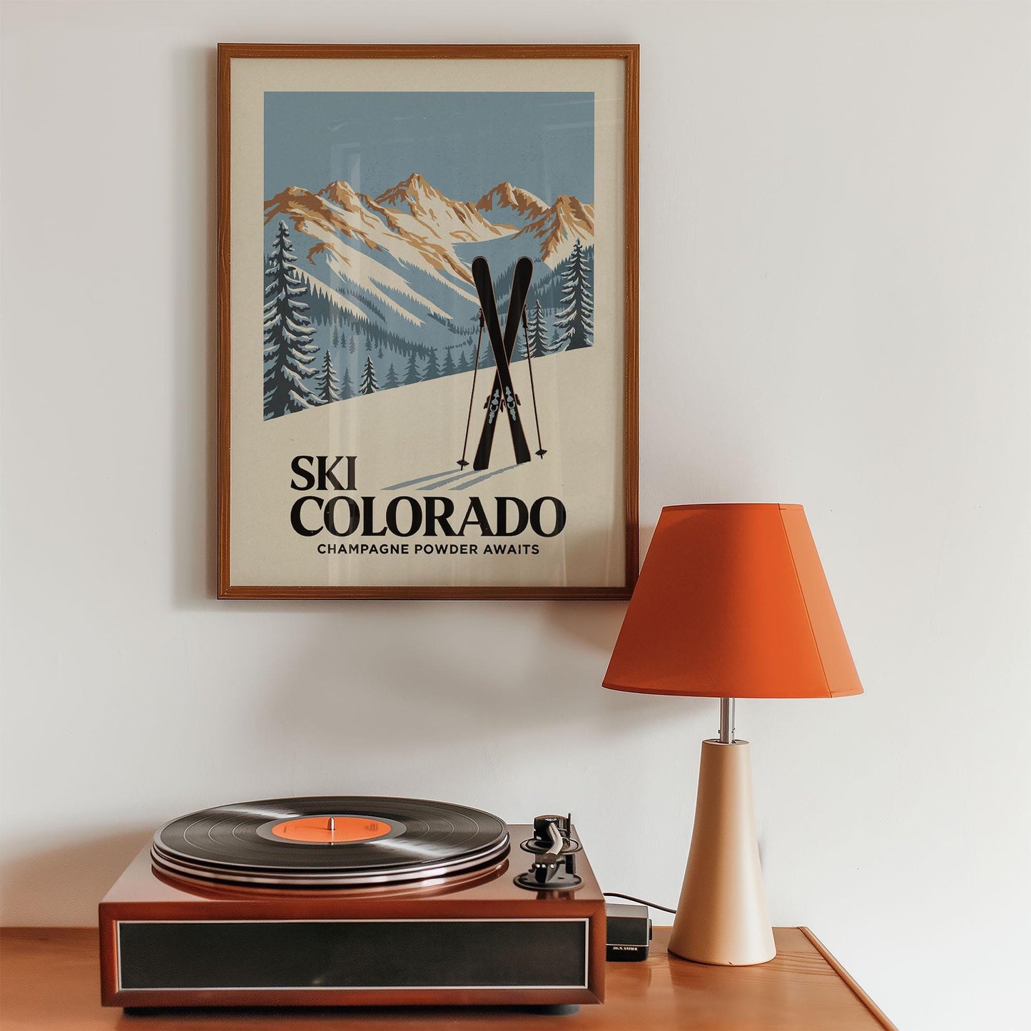 a record player sitting on top of a wooden table