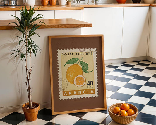 a framed stamp with an illustration of a lemon and a price of 40 LIRES, placed on a checkered floor next to a potted plant and a basket of oranges.