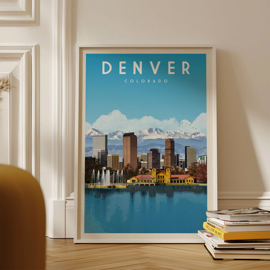 A framed poster of the Denver skyline, with the city's iconic buildings and landmarks visible, is displayed on a wall.