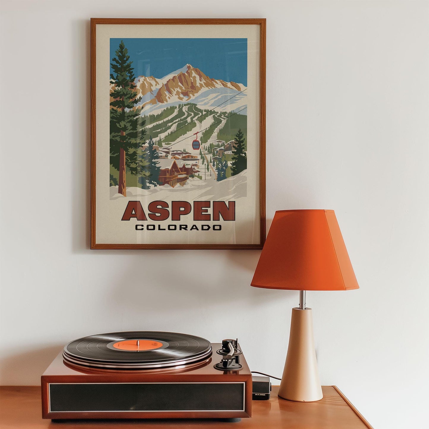 a record player sitting on top of a wooden table