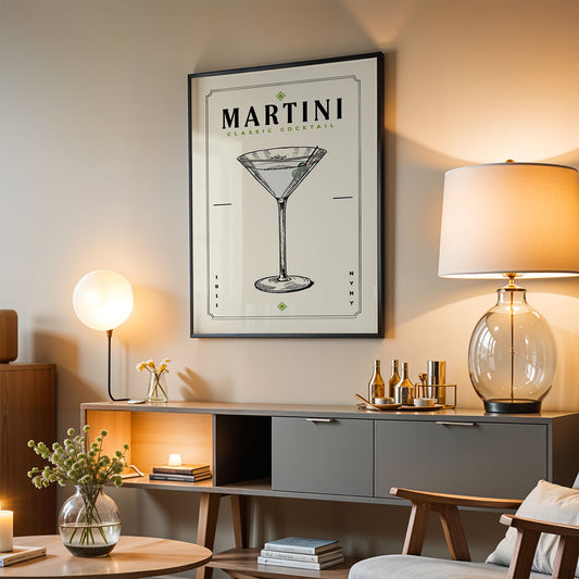 a living room with a framed poster of a martini glass hanging on the wall, a wooden cabinet below it, and a lamp on a side table.
