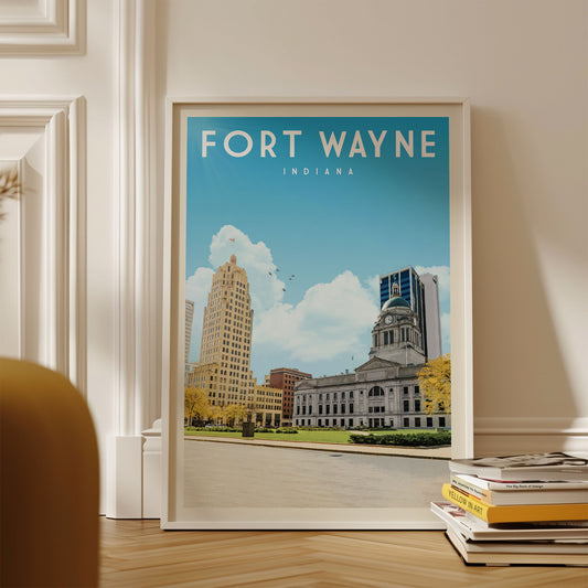 A framed poster of Fort Wayne, Indiana, with a cityscape featuring the Indiana State Capitol building and other notable structures.