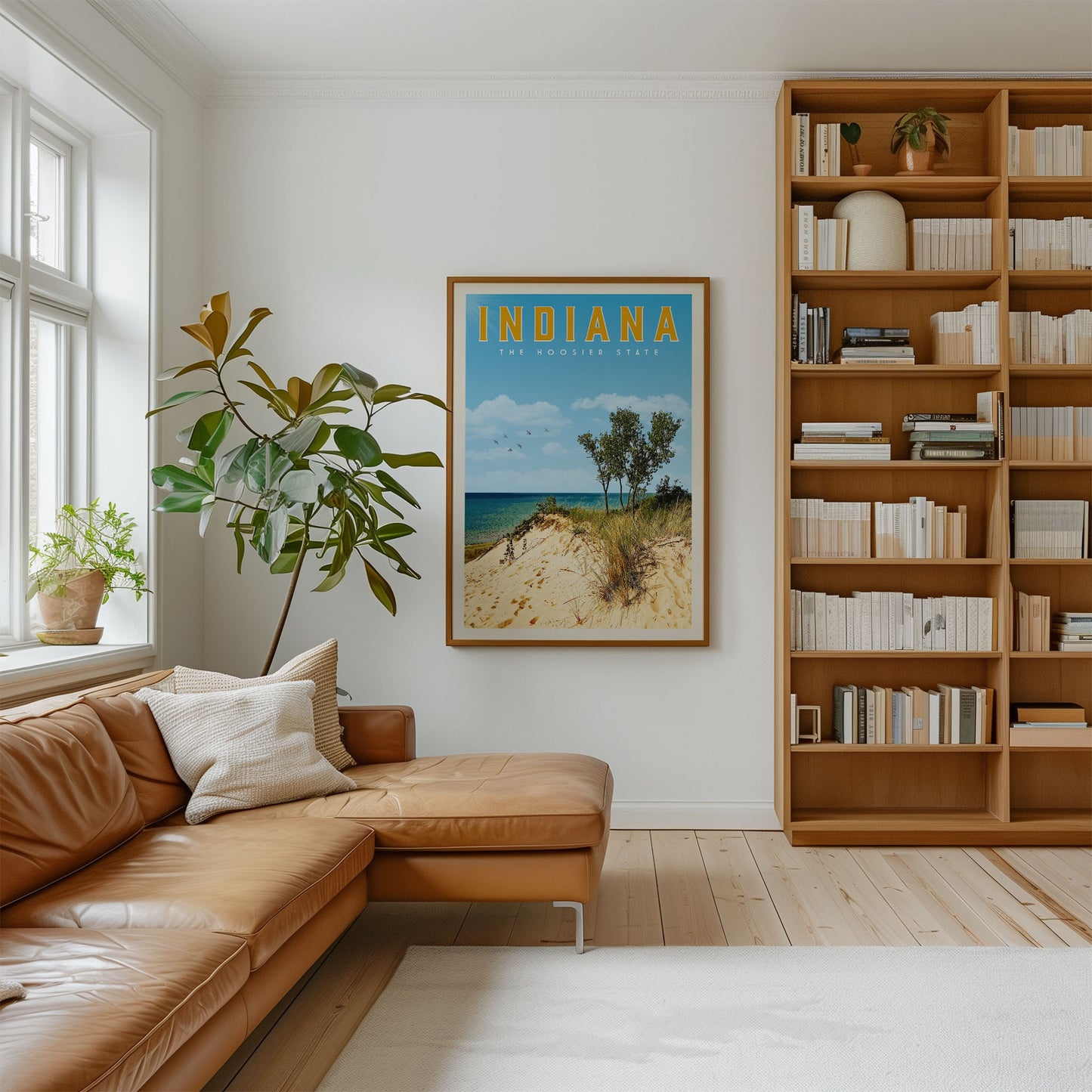 a cozy living room with a large bookshelf filled with books, a comfortable leather couch, and a framed poster of a beach scene hanging on the wall.