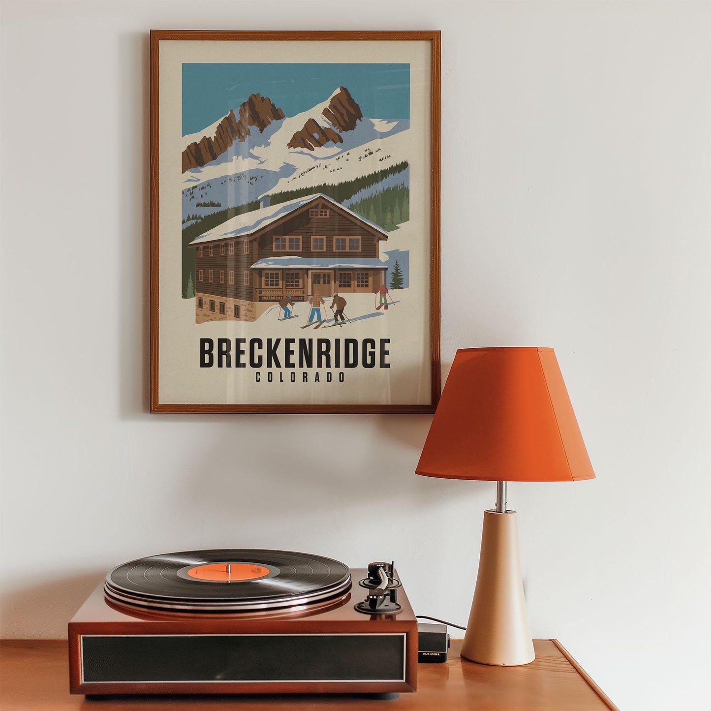 a record player sitting on top of a wooden table