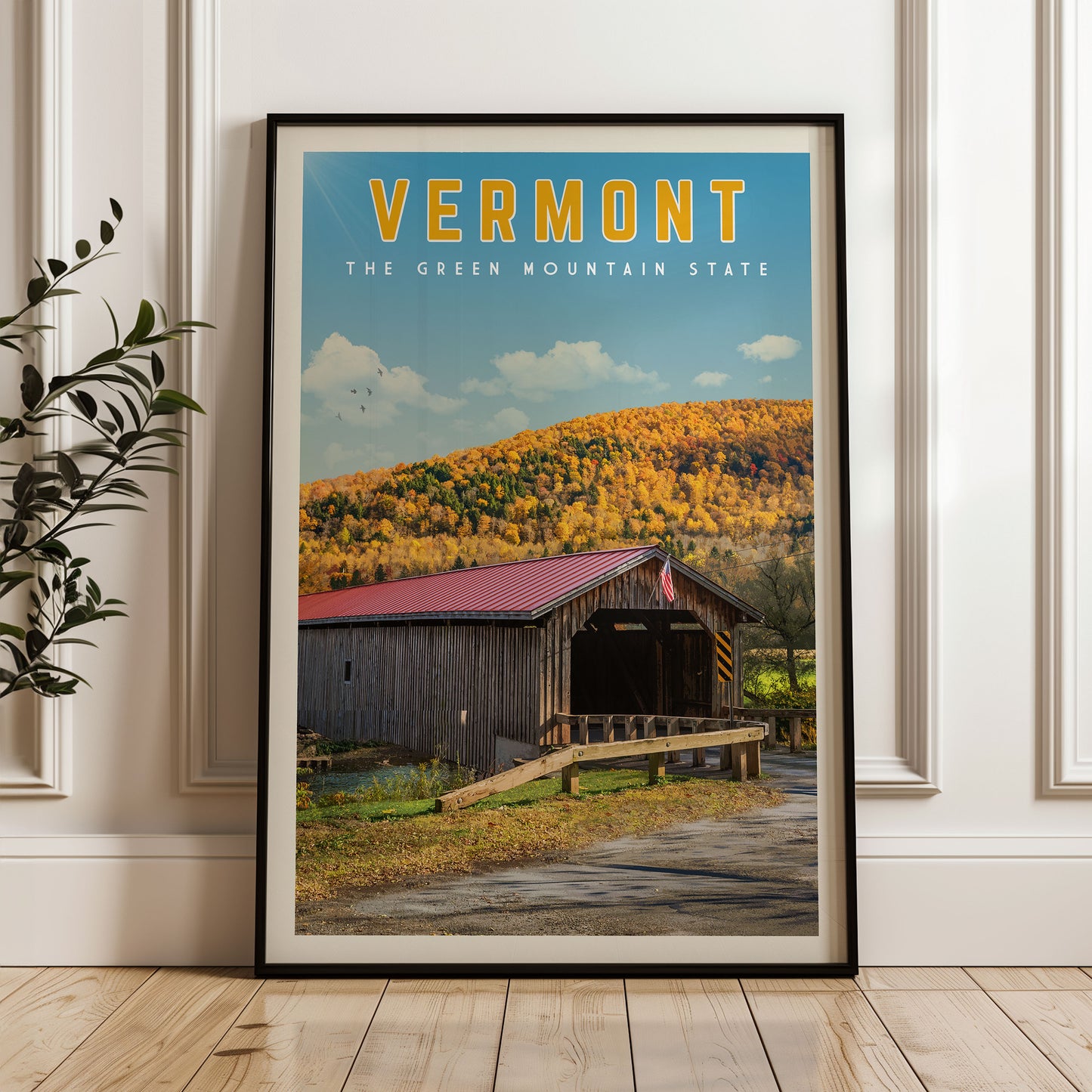 The image is a framed poster of a wooden covered bridge in Vermont, with a scenic mountain landscape in the background.
