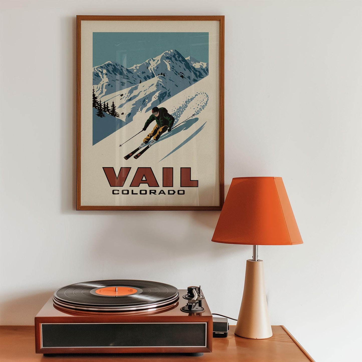 a record player sitting on top of a wooden table