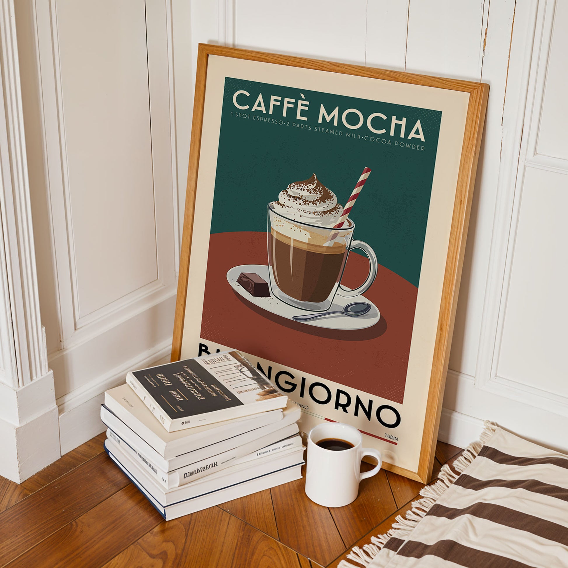 a framed poster of a mocha drink, along with a stack of books and a cup of coffee on a wooden floor.