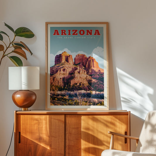 a framed poster of the Grand Canyon State of Arizona, with a wooden cabinet and a lamp in the foreground.