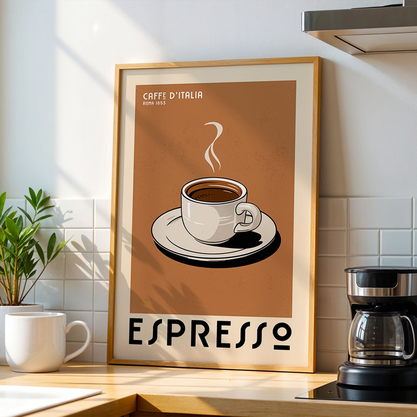 a framed poster of a cup of espresso on a kitchen counter, with a coffee maker and a potted plant in the background.