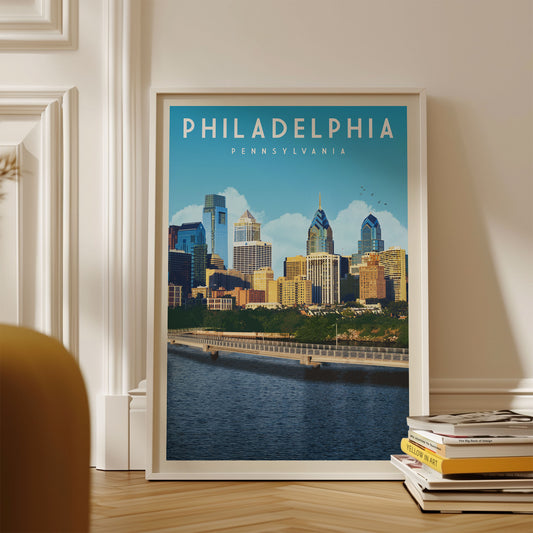 A framed poster of the Philadelphia skyline, with the city's iconic skyscrapers and landmarks visible, is displayed on a wall.