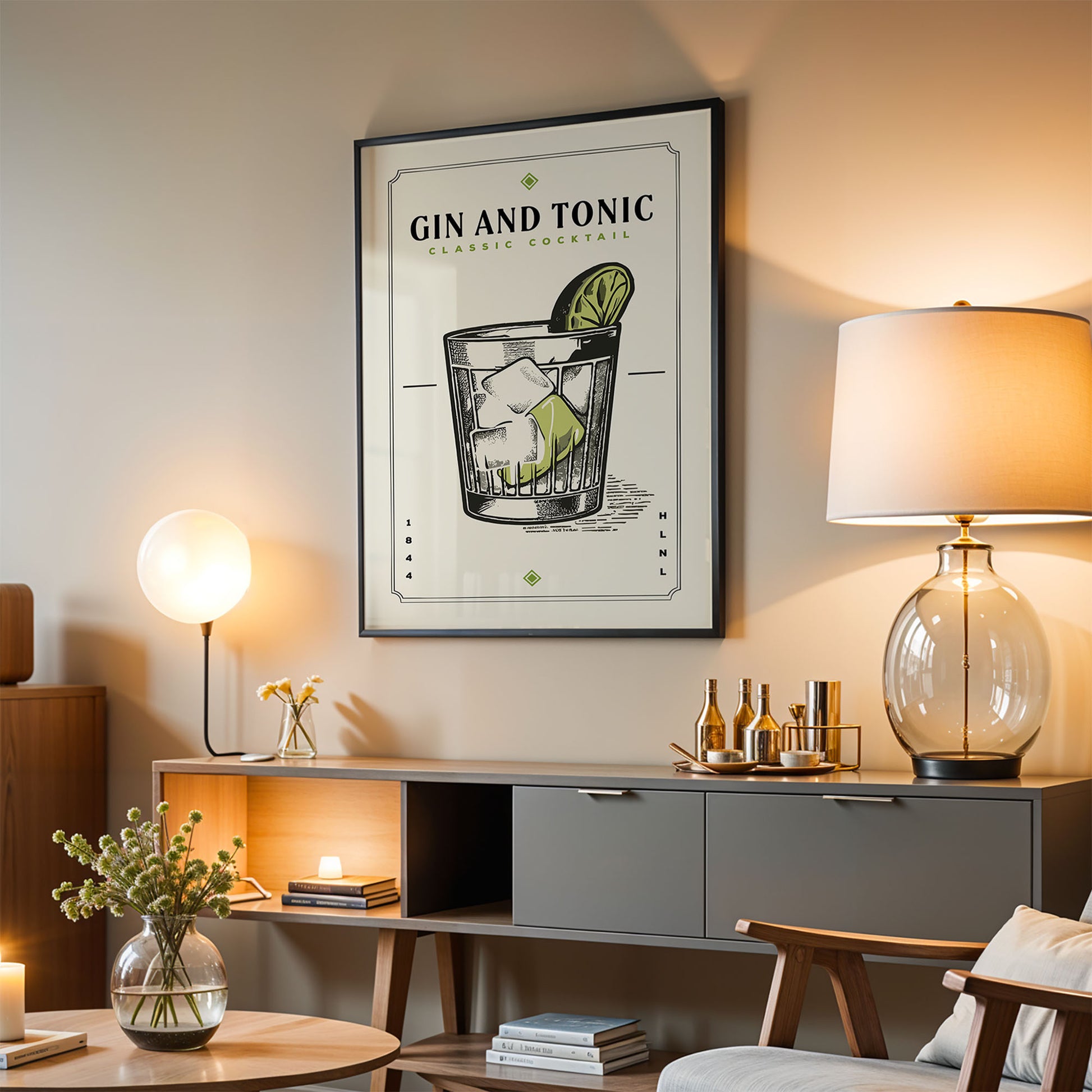 a living room with a framed poster of a gin and tonic cocktail hanging on the wall. The poster includes a detailed illustration of the cocktail glass and a lime. The room also has a wooden cabinet, a lamp, and a vase with flowers, creating a cozy and stylish atmosphere.