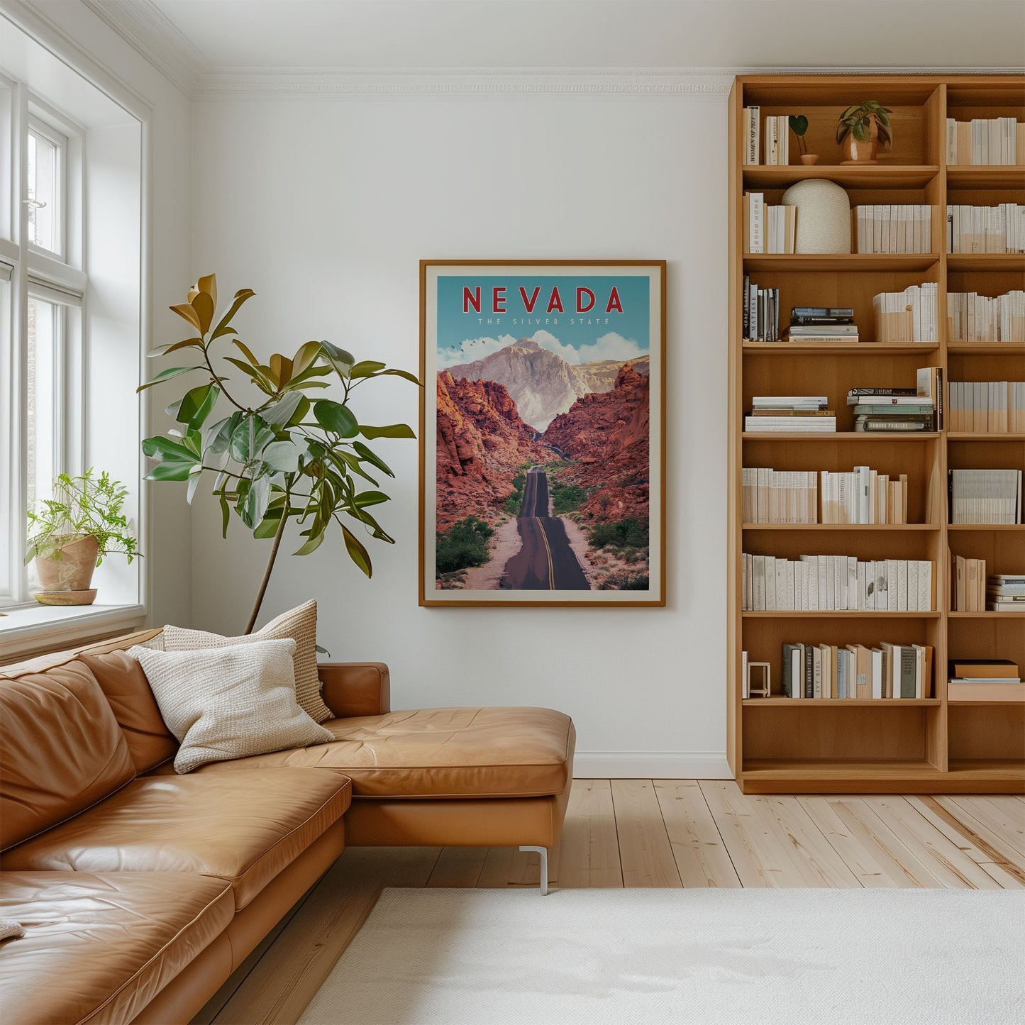 a cozy living room with a large window, a comfortable leather couch, a bookshelf filled with books, and a framed poster of a scenic mountain landscape hanging on the wall.
