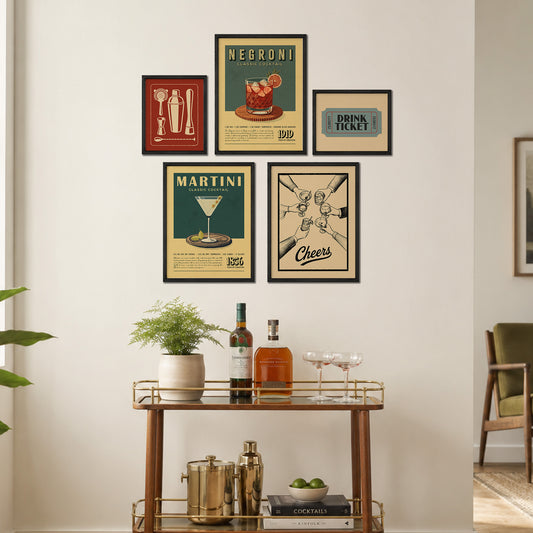 a wall display with framed vintage-style posters and a wooden bar cart with various drinkware and decorative items.