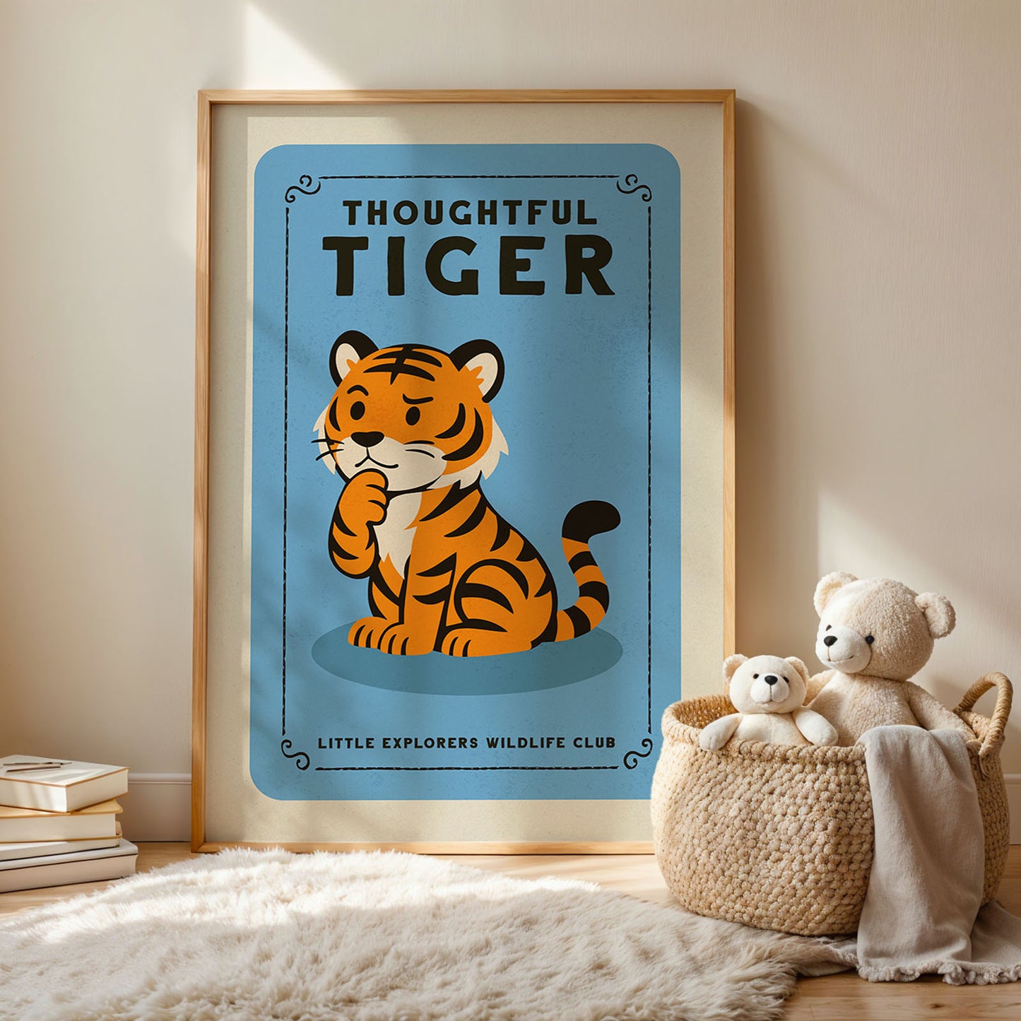 a framed poster of a tiger with the text "THOUGHTFUL TIGER" and "LITTLE EXPLORERS WILDLIFE CLUB" below it, along with a small illustration of a stuffed animal tiger.