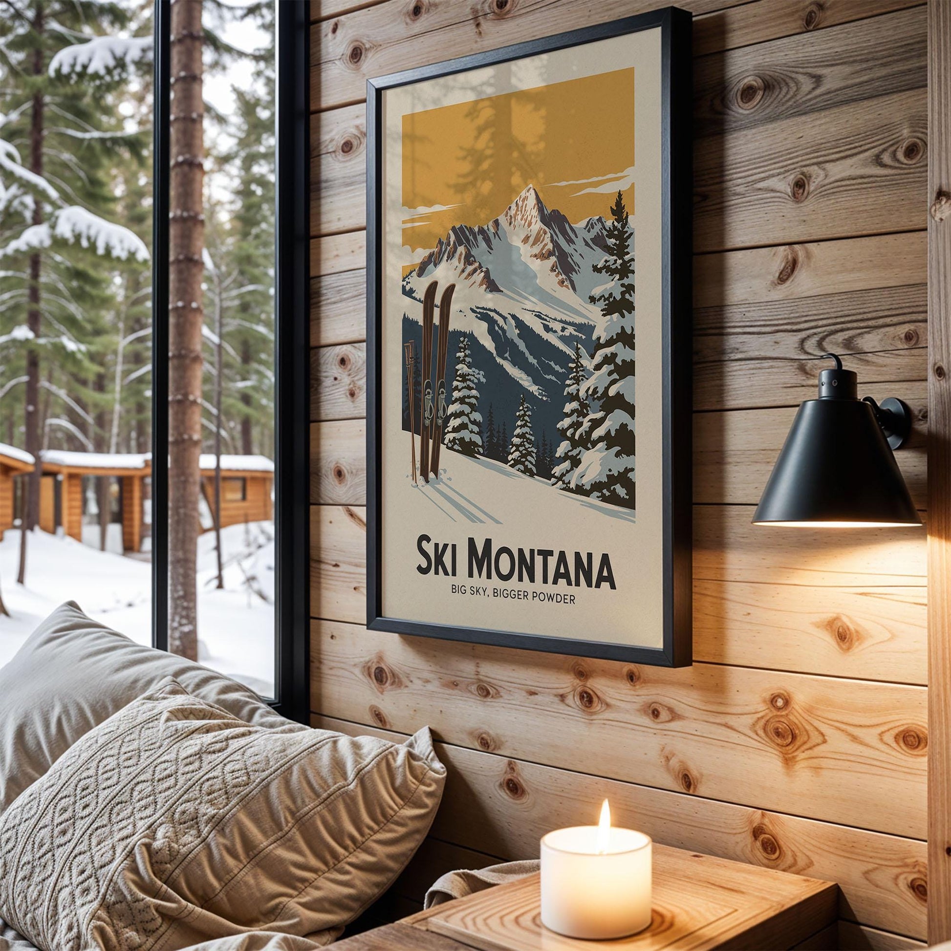 A framed poster of a snowy mountain landscape with ski equipment hangs on a wooden wall, accompanied by a lit candle and a cozy couch in a cabin-like setting.