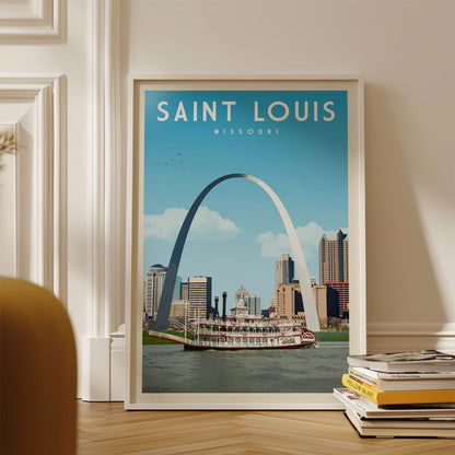 A framed poster of the Gateway Arch in St. Louis, Missouri, with a riverboat in the foreground and the city skyline in the background.