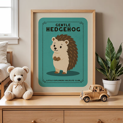 a framed poster of a hedgehog with the text "GENTLE HEDGEHOG" and "LITTLE EXPLORERS WILDLIFE CLUB" below it, along with a teddy bear and a toy truck on a wooden dresser.