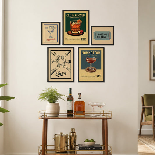 a wall display with framed vintage advertisements and a bar cart with various drinks and accessories.