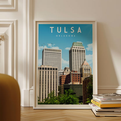 A framed poster of the skyline of Oklahoma City, with the city's iconic skyscrapers and buildings visible against a blue sky.