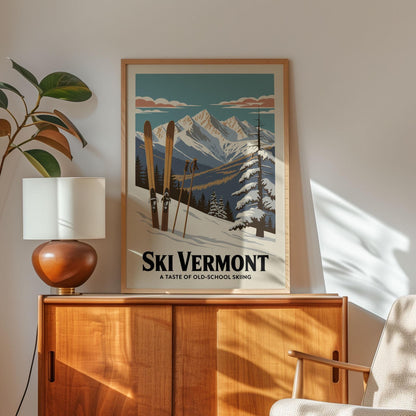 A framed poster of a snowy mountain landscape with skis is displayed on a wooden cabinet, accompanied by a lamp and a plant in the corner of the room.