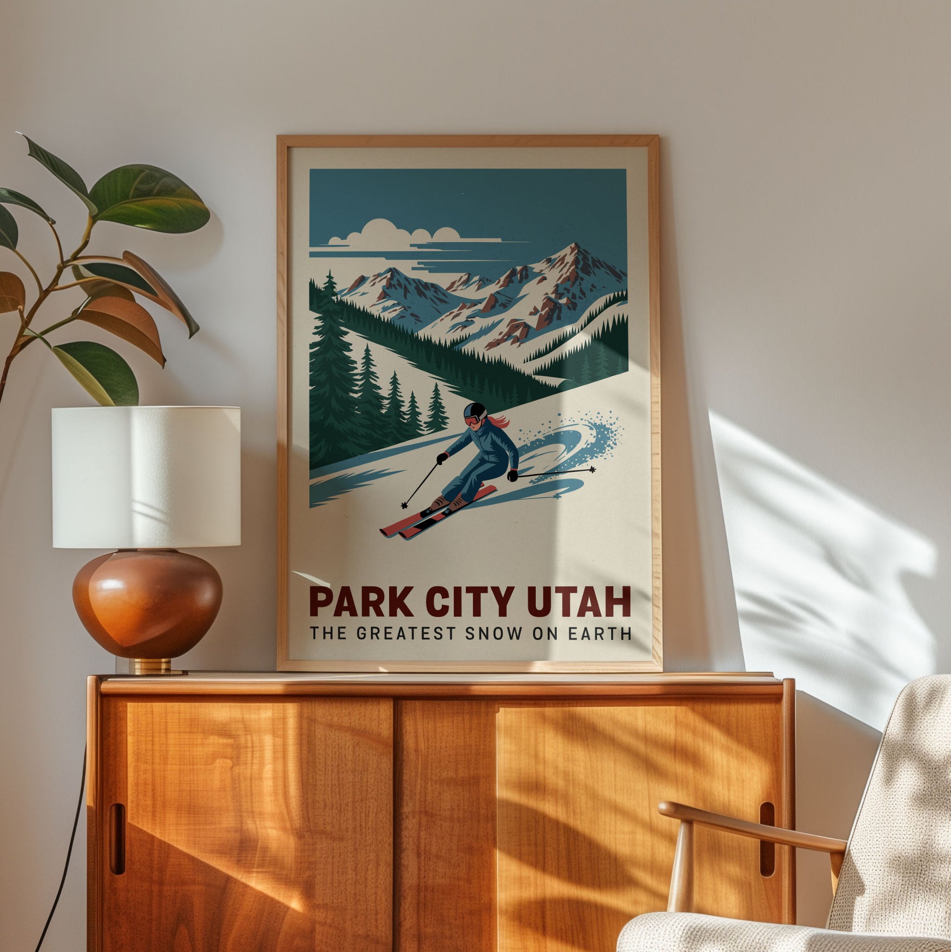 A framed poster of a skier in a snowy mountain landscape, with the text "PARK CITY UTAH THE GREATEST SNOW ON EARTH" below the image.