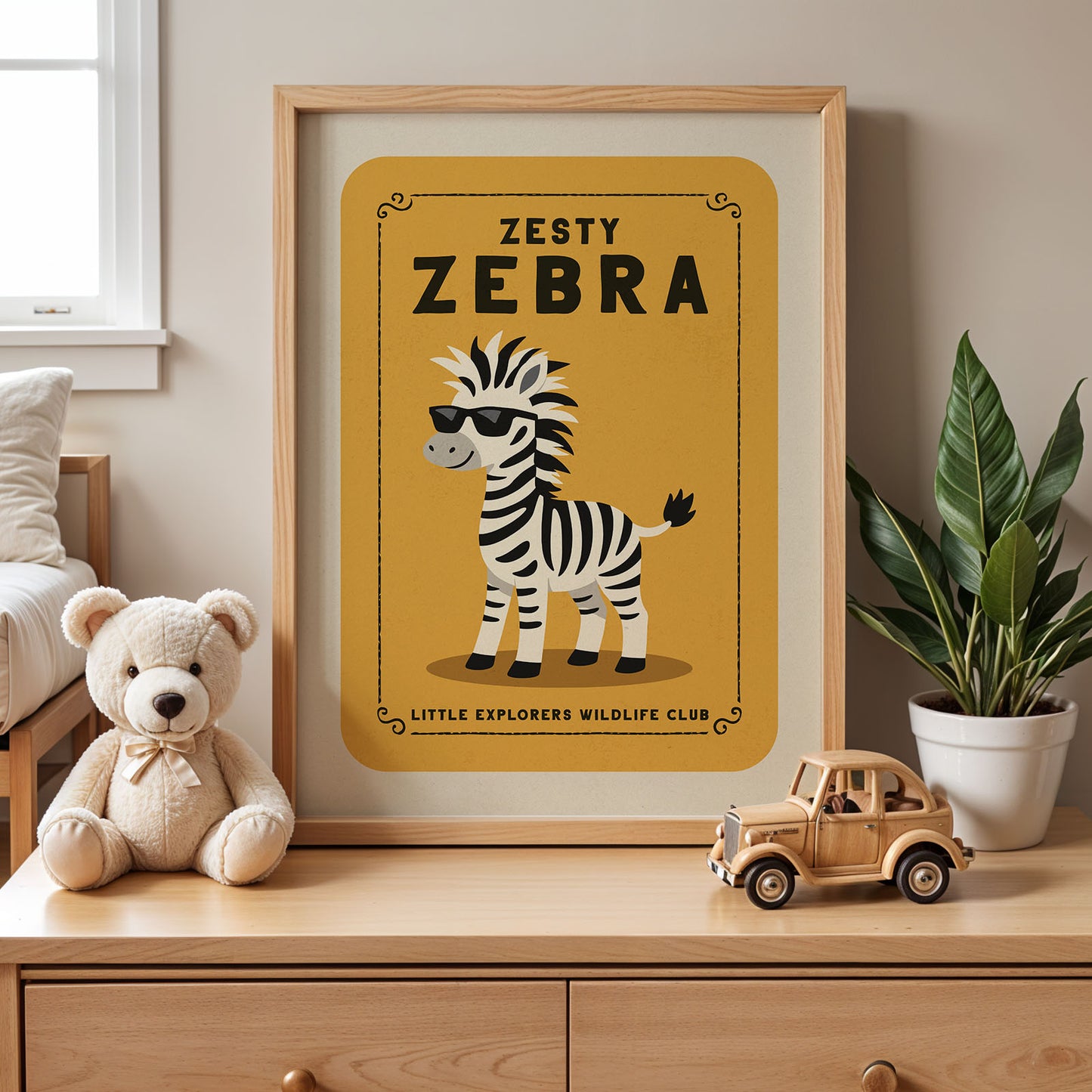 a framed poster of a zebra with sunglasses, accompanied by a teddy bear and a toy truck on a wooden dresser.