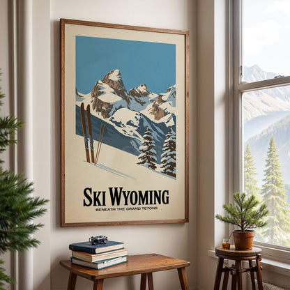 A framed poster of a snowy mountain landscape with skis hanging on the wall, depicting a scenic winter scene.