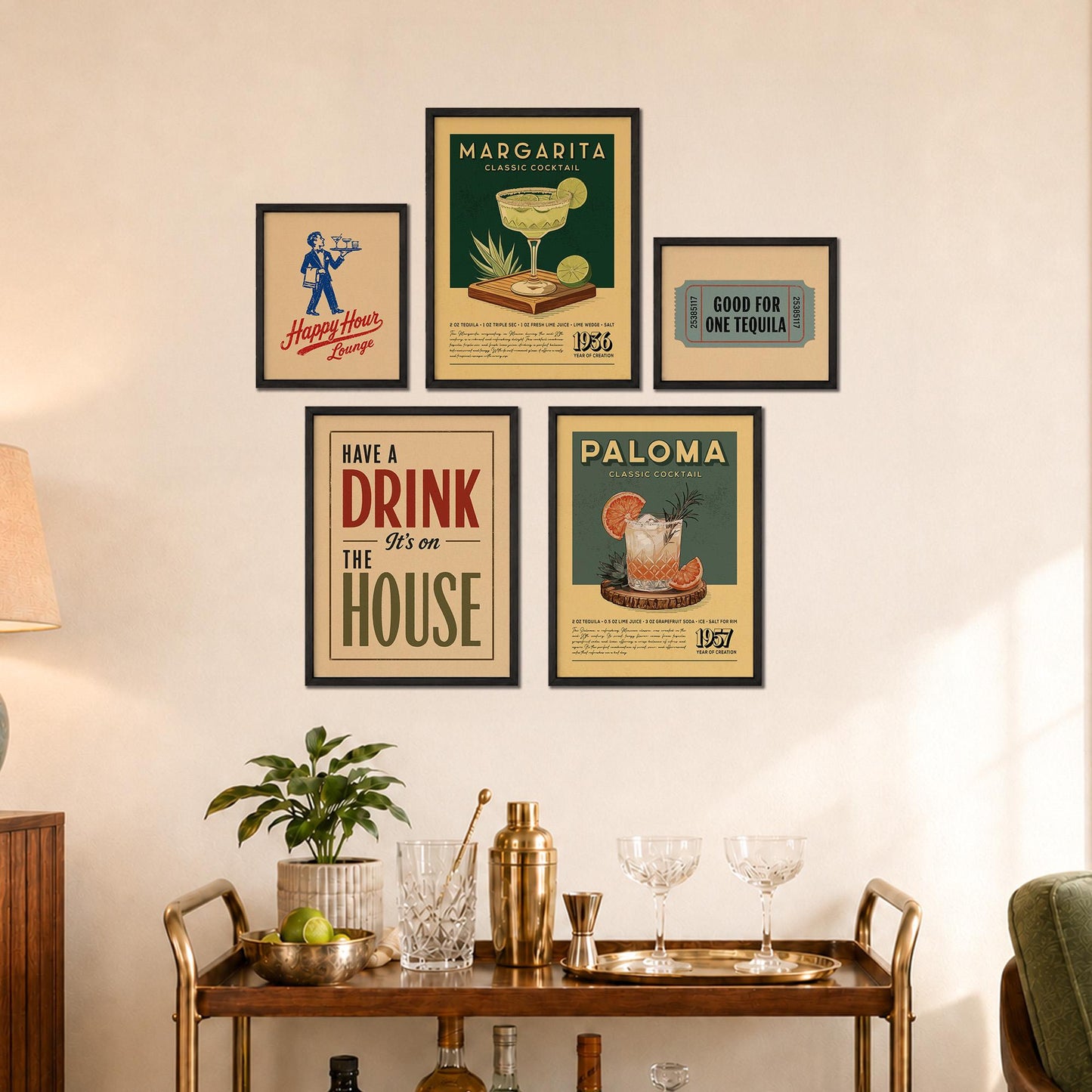 a wall with a collection of framed vintage-style posters and a wooden bar cart with various drinkware and decorative items.