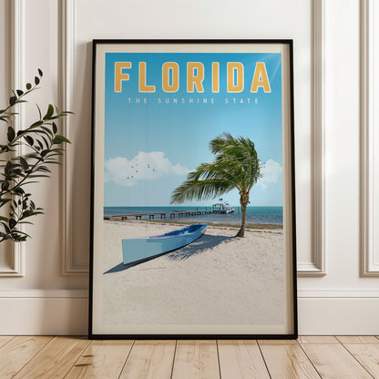A framed poster of a beach scene in Florida, featuring a palm tree, a boat, and a pier.