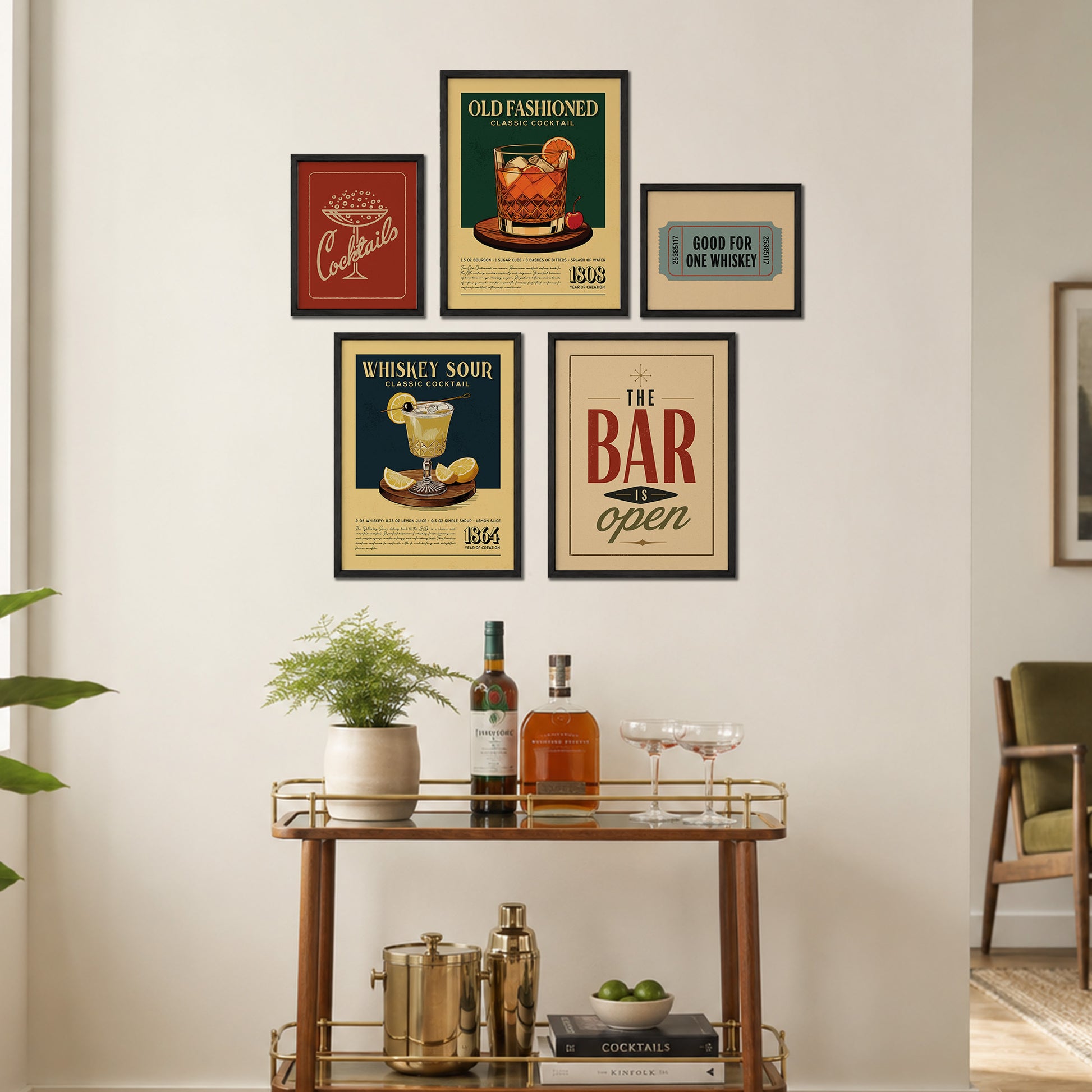a wall display with framed vintage advertisements for whiskey, cocktails, and a bar, along with a wooden bar cart and various drinkware and accessories.
