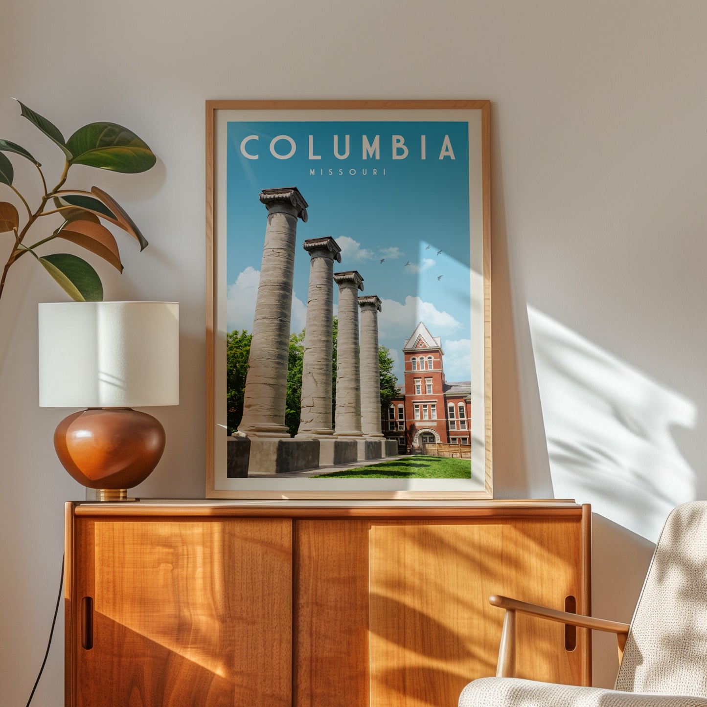 a framed poster of the historic architecture of Columbia, Missouri, with a view of the University of Missouri building and its columns.