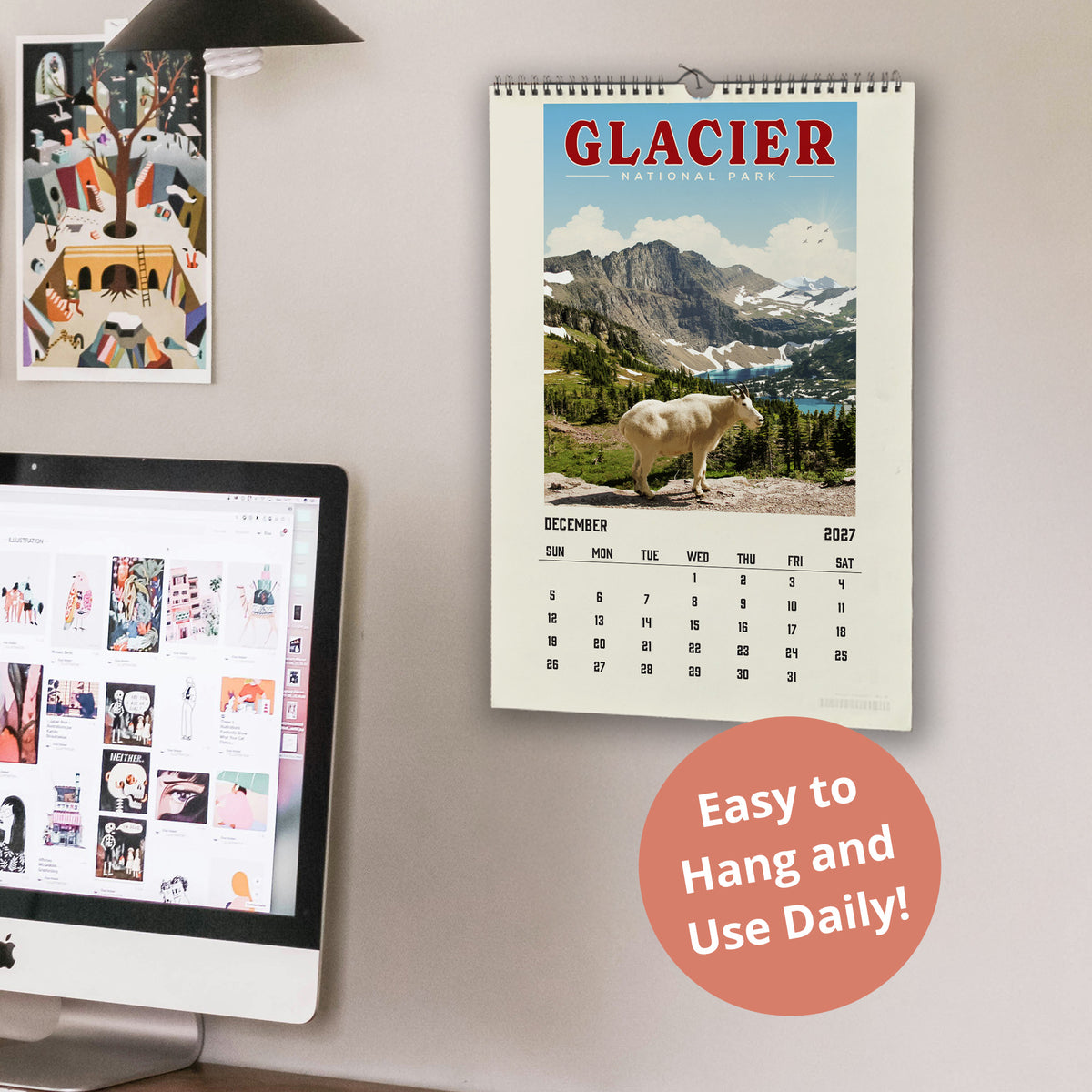a wall with a calendar for Glacier National Park hanging on it, along with a computer monitor displaying a webpage. The calendar is titled "Glacier National Park" and includes a photo of a mountain goat. The computer monitor displays a webpage with various images and text. The phrase "Easy to Hang and Use Daily!" is visible in the image.