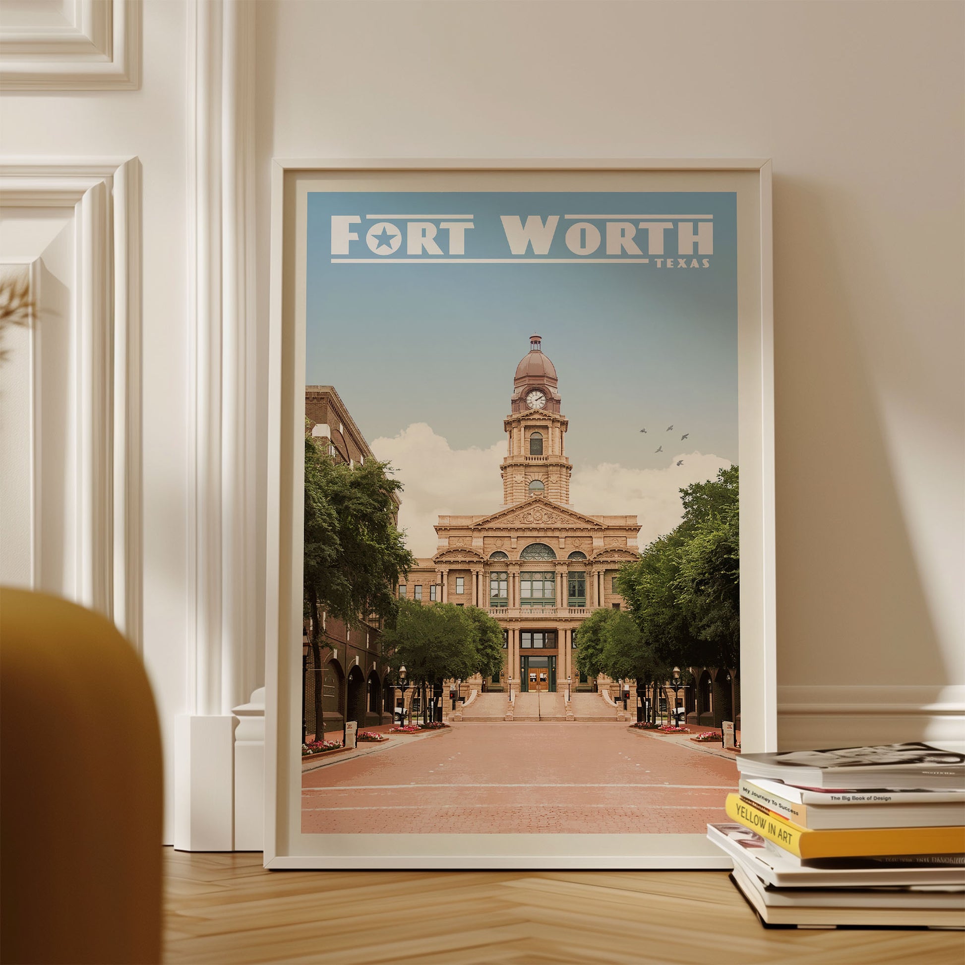 A framed poster of the Fort Worth, Texas cityscape, featuring a large building with a clock tower and surrounded by trees.