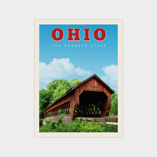 a covered wooden bridge spanning a river, with lush greenery and a clear blue sky in the background.