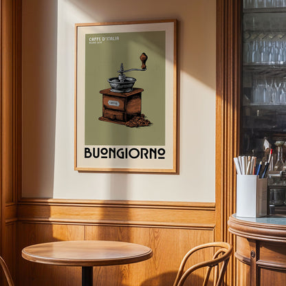 a framed poster of a coffee grinder on a wall, with a wooden table and chairs in the foreground.