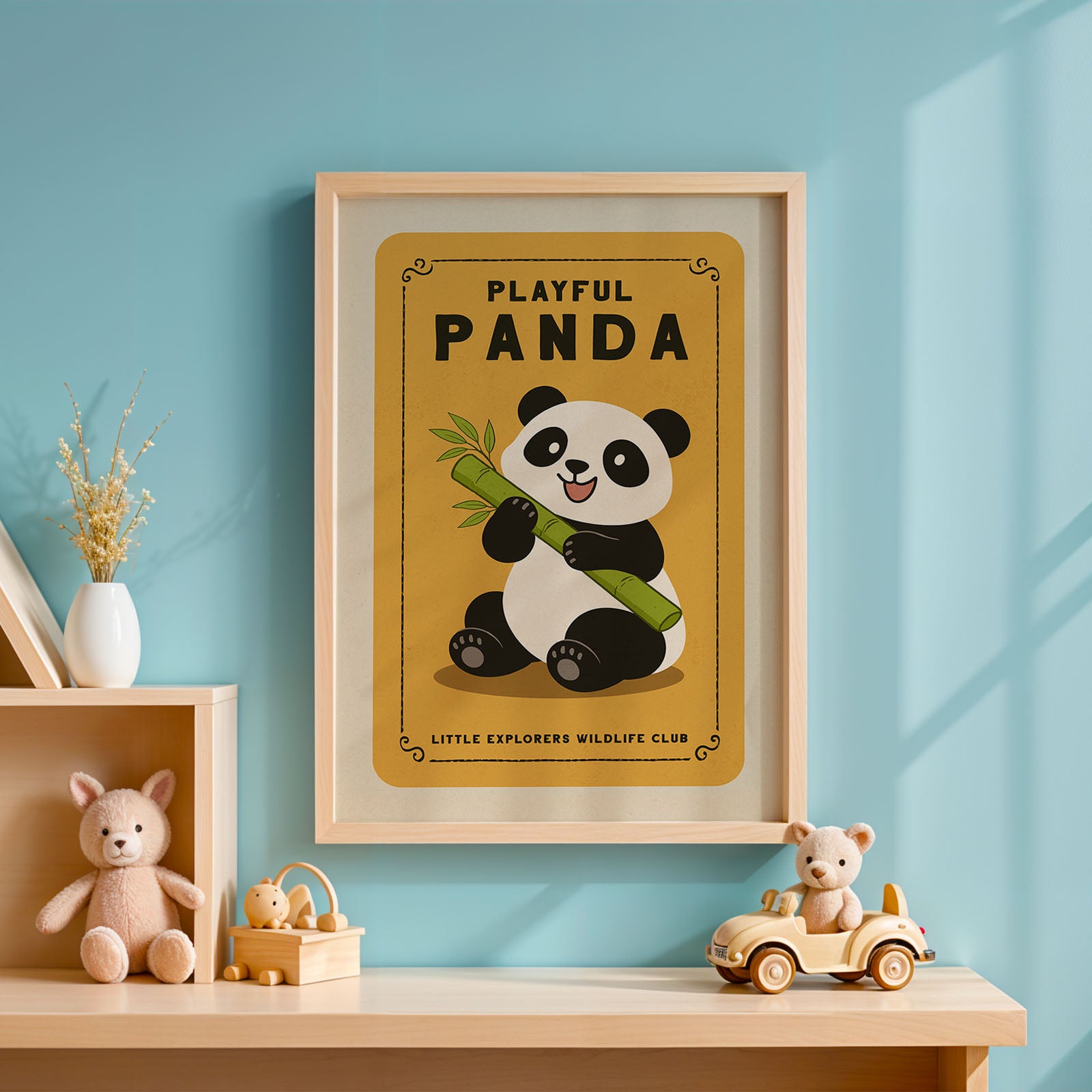 a framed poster of a panda holding a bamboo shoot, with the text "PLAYFUL PANDAS" and "LITTLE EXPLORERS WILDLIFE CLUB" below it. The poster is hanging on a blue wall, and there are some stuffed animals and a toy car on a shelf below it.