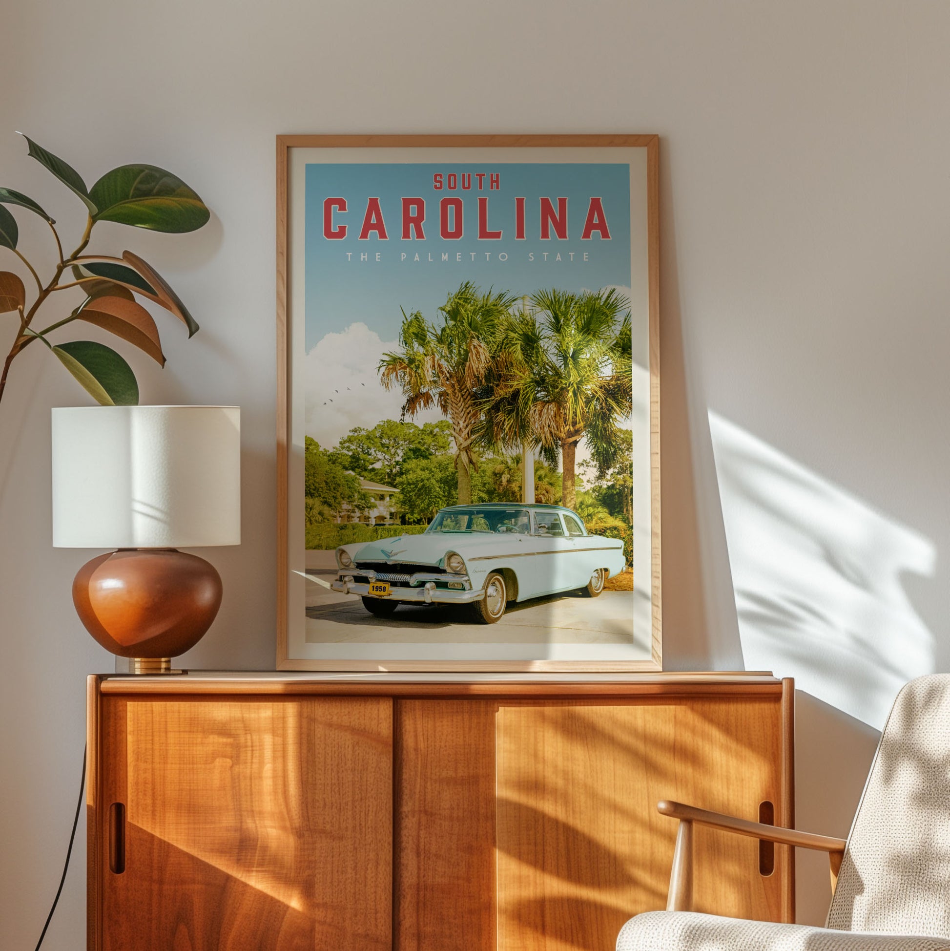 a framed poster of a classic car, specifically a white Ford Mustang, displayed on a wooden cabinet.