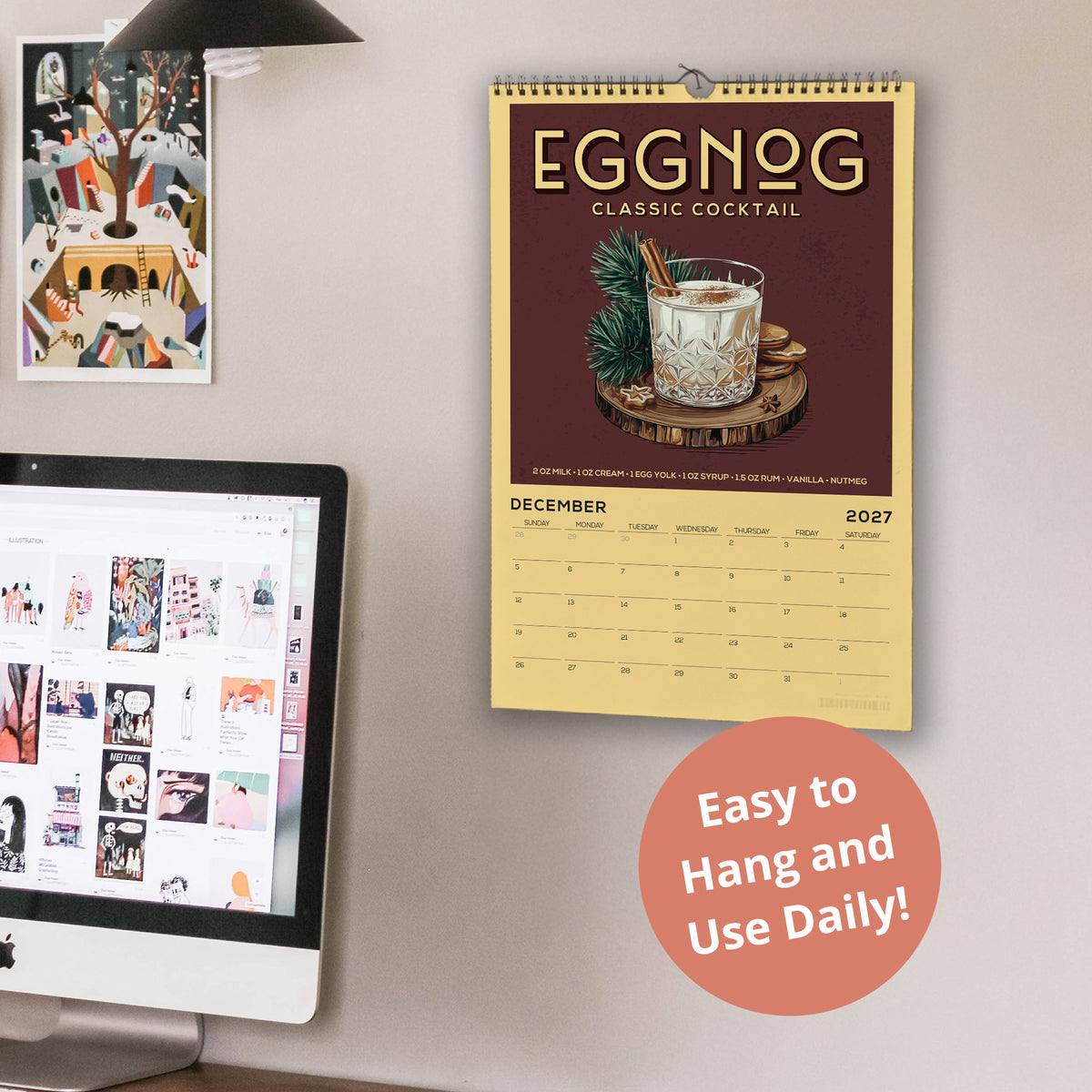 a wall with a calendar for the year 2027, a computer monitor, and a desk with a laptop. The calendar displays a picture of a cocktail and includes the text "Eggnog Classic Cocktail".