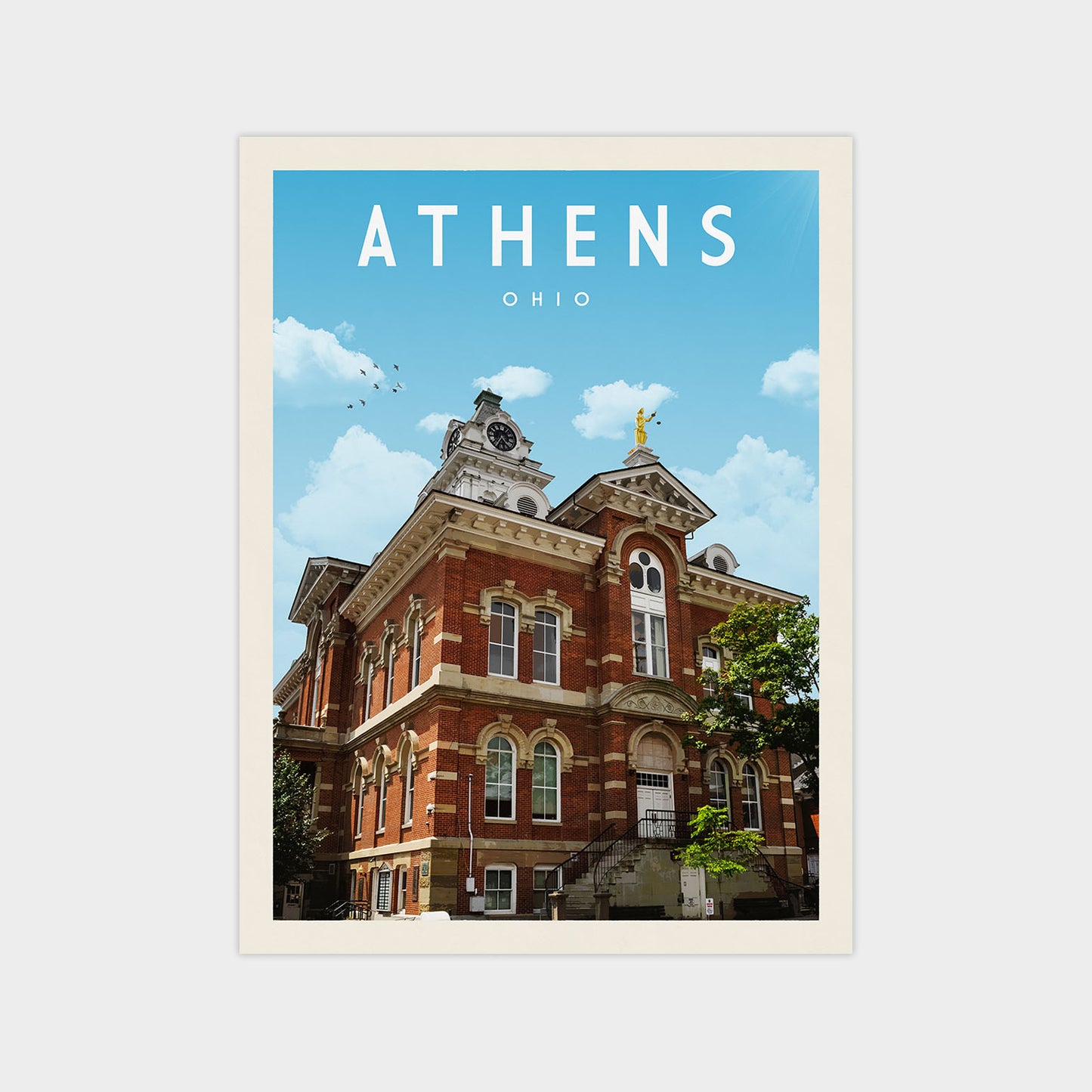 a large, ornate brick building with a clock tower, set against a blue sky with white clouds.
