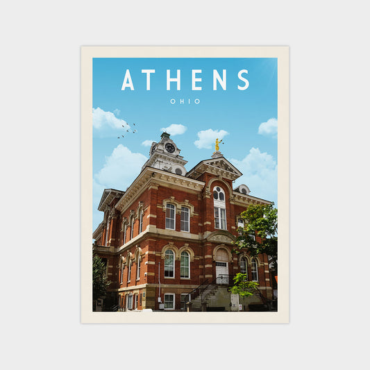 a large, ornate brick building with a clock tower, set against a blue sky with white clouds.