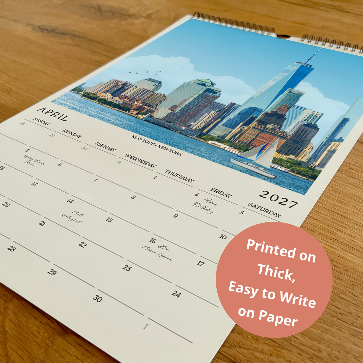 A wall calendar with a cityscape image of New York City on the cover, printed on paper.