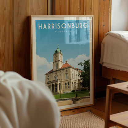 A framed poster of the historic Harrisonburg, Virginia, with a large building and a tree in the background.