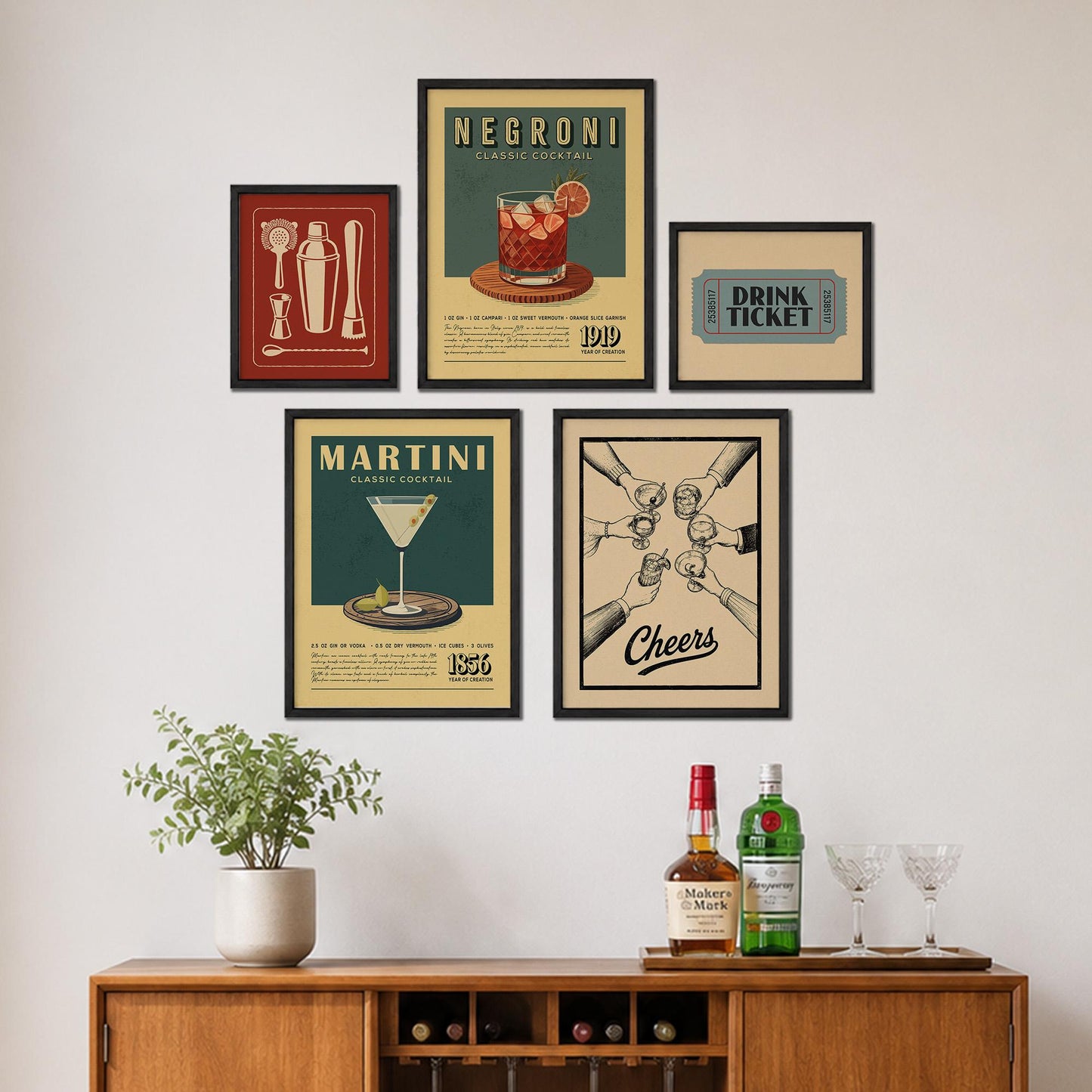 a wall display with framed vintage-style posters and a wooden cabinet with bottles of alcohol and glasses.