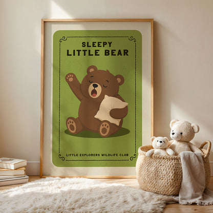 a framed poster of a sleeping bear, with a basket of stuffed bears next to it on a rug.