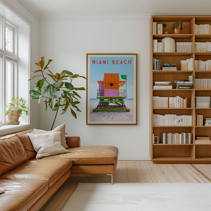 a cozy living room with a brown leather sofa, a large window, a bookshelf filled with books, and a framed poster of a beach house on the wall.