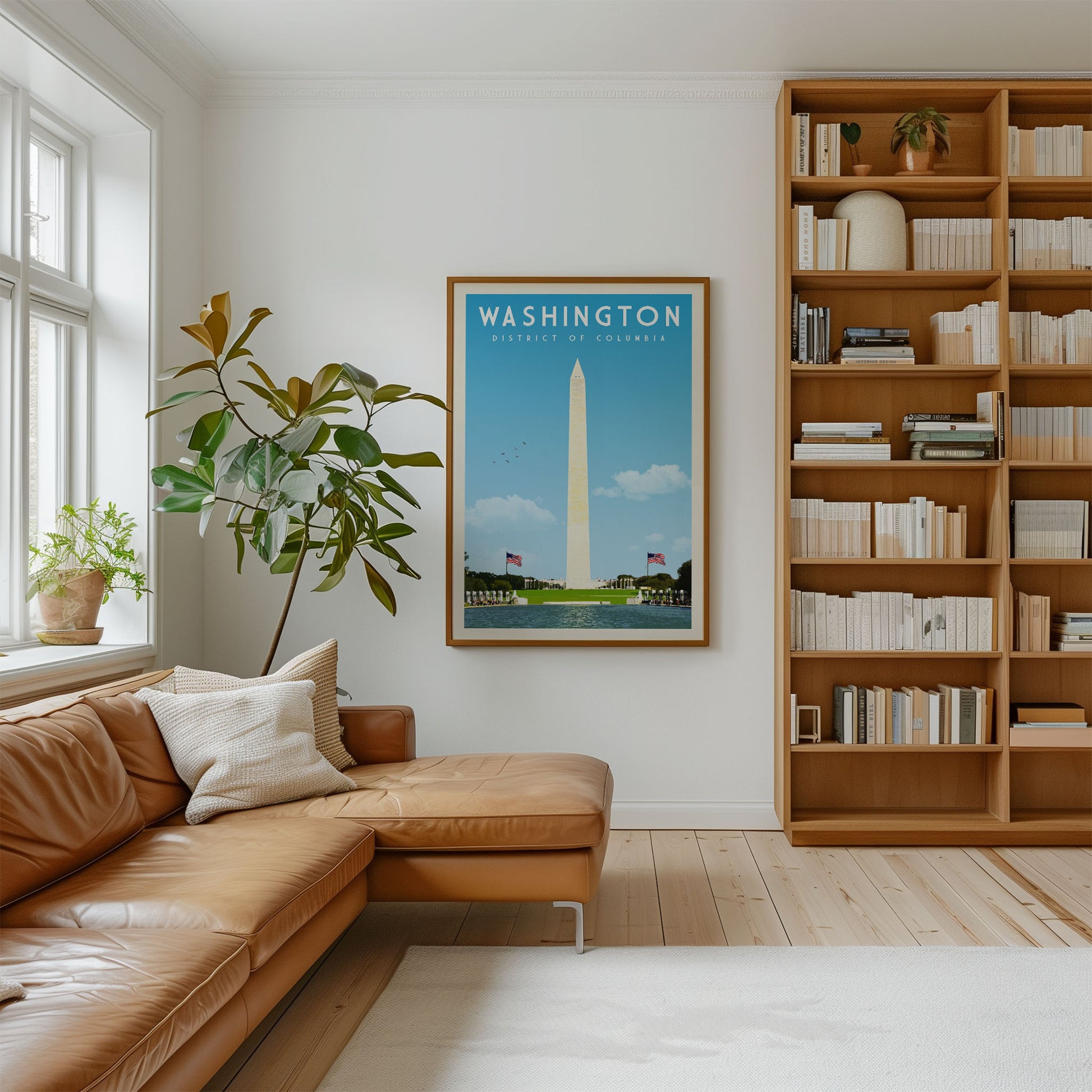 a cozy living room with a brown leather sofa, a large bookshelf filled with books, and a framed poster of the Washington Monument hanging on the wall.