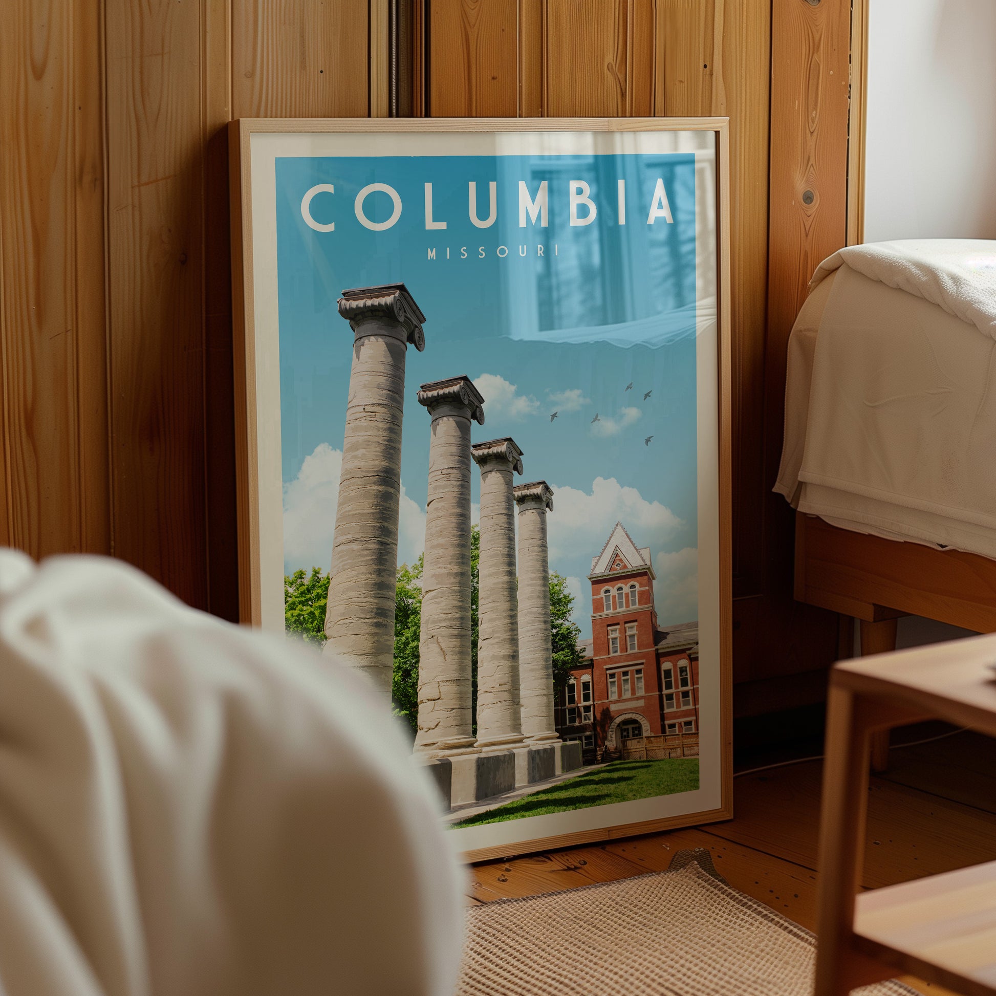 A framed poster of the historic architecture of Columbia, Missouri, featuring the columns of the University of Columbia.