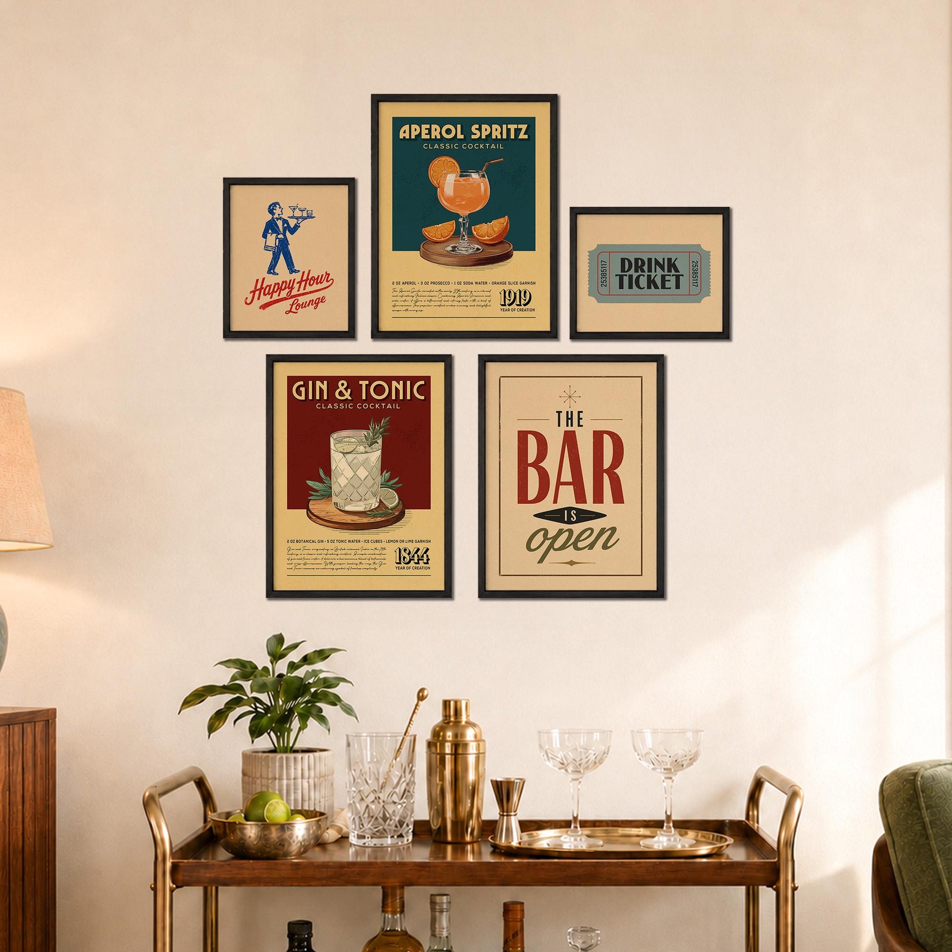 a wall display with framed vintage advertisements for a bar and a cocktail lounge, along with a wooden bar cart and various cocktail-making accessories.
